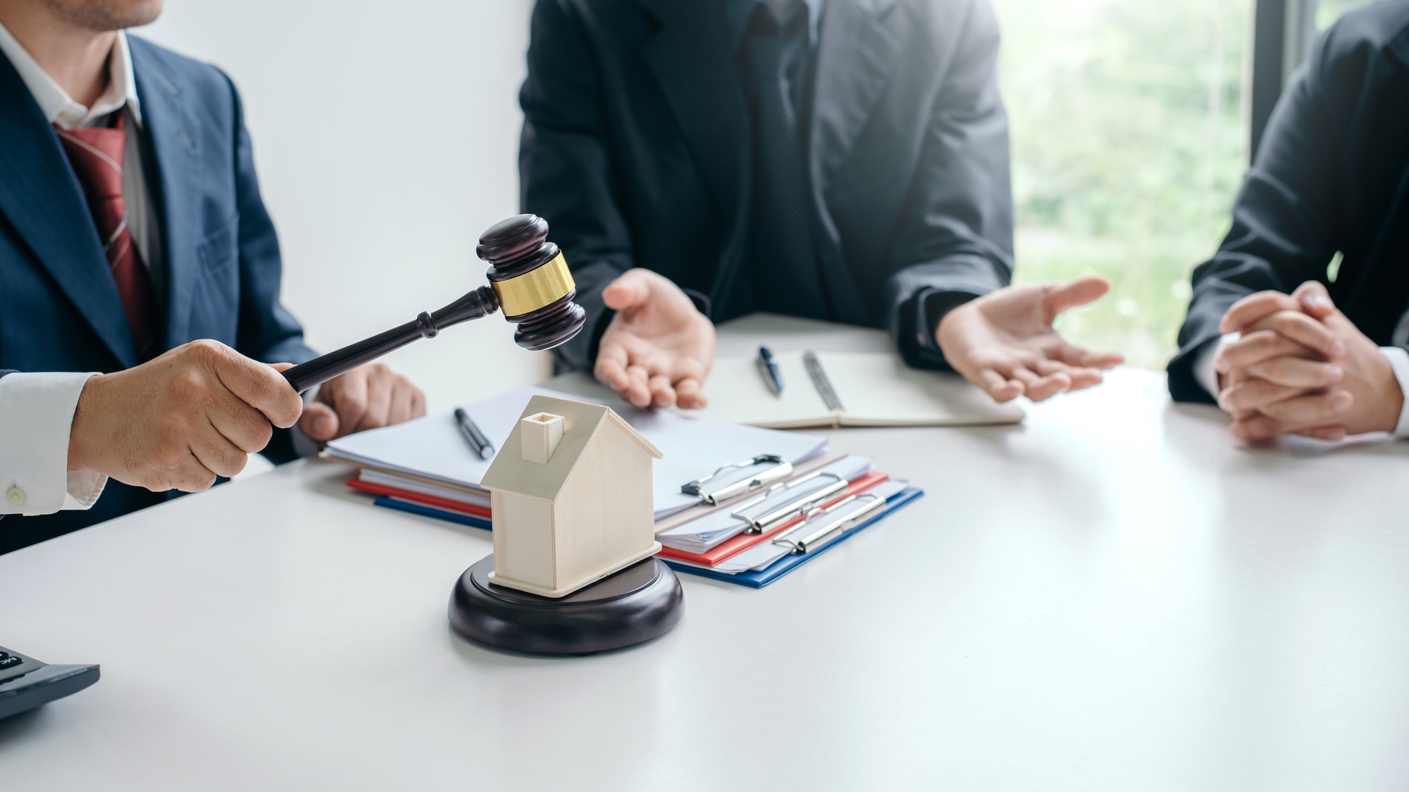 Lawyer working about legal legislation in courtroom to help their customer.