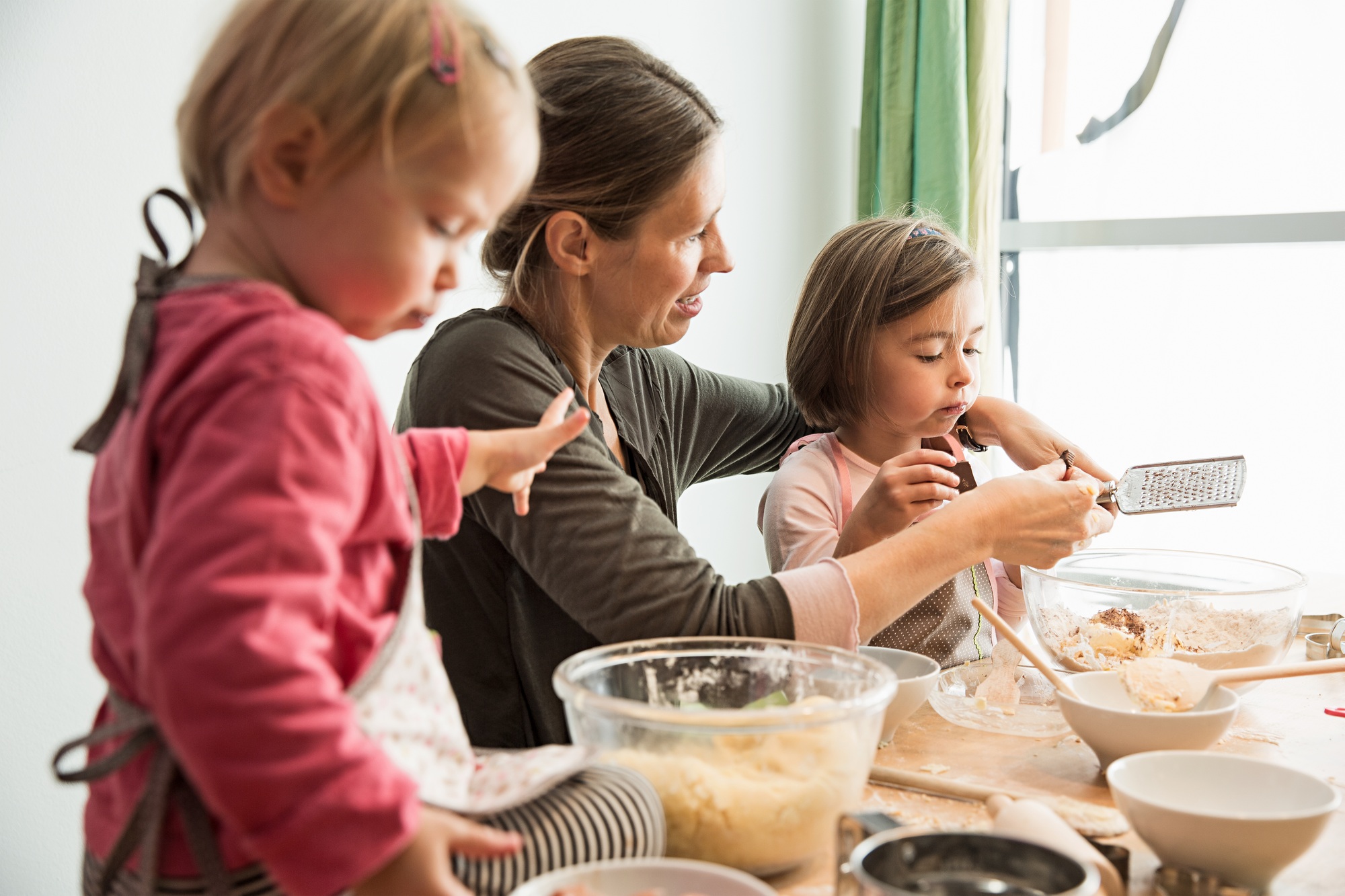 Mother and children baking
