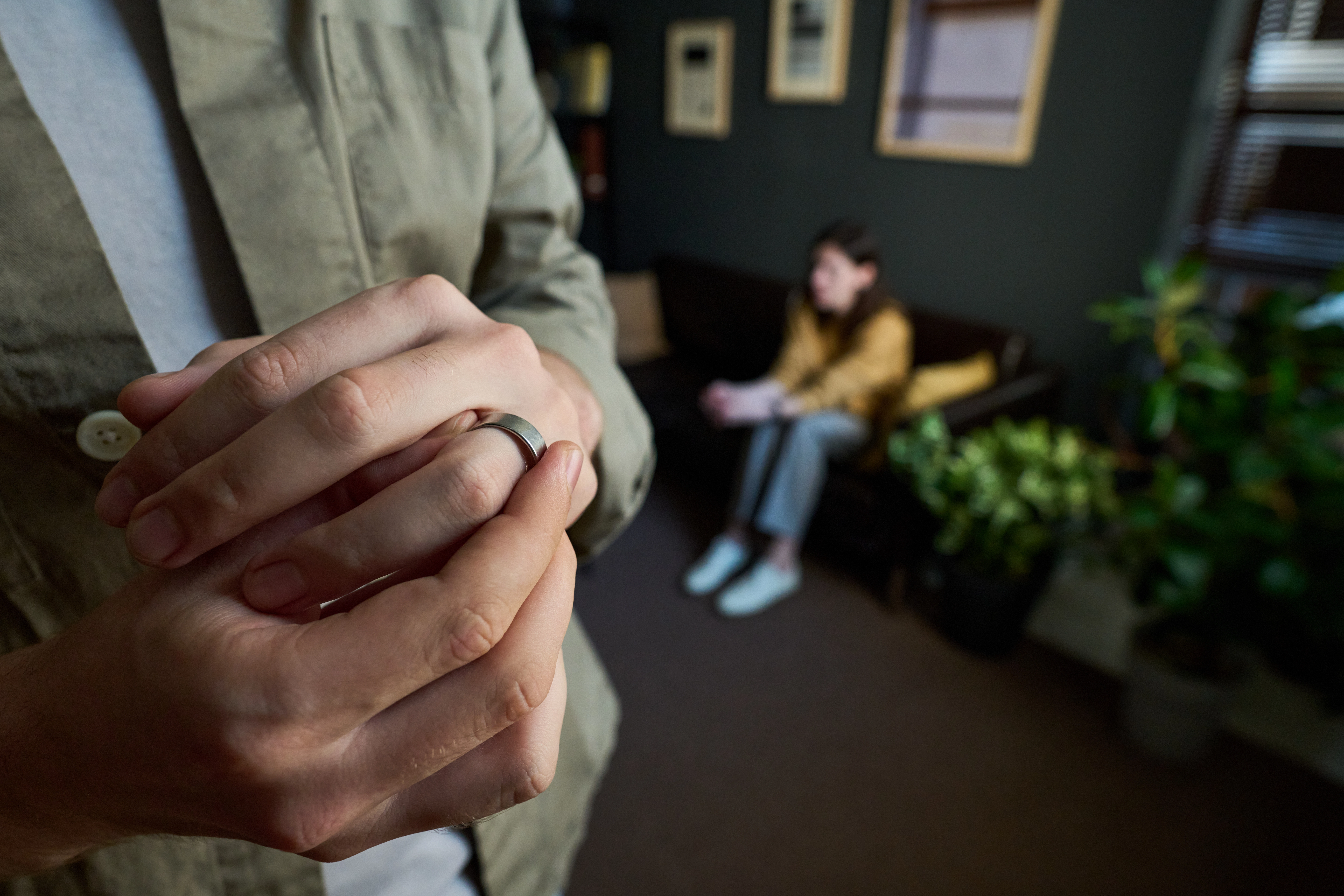 caucasian young adult male removing wedding ring