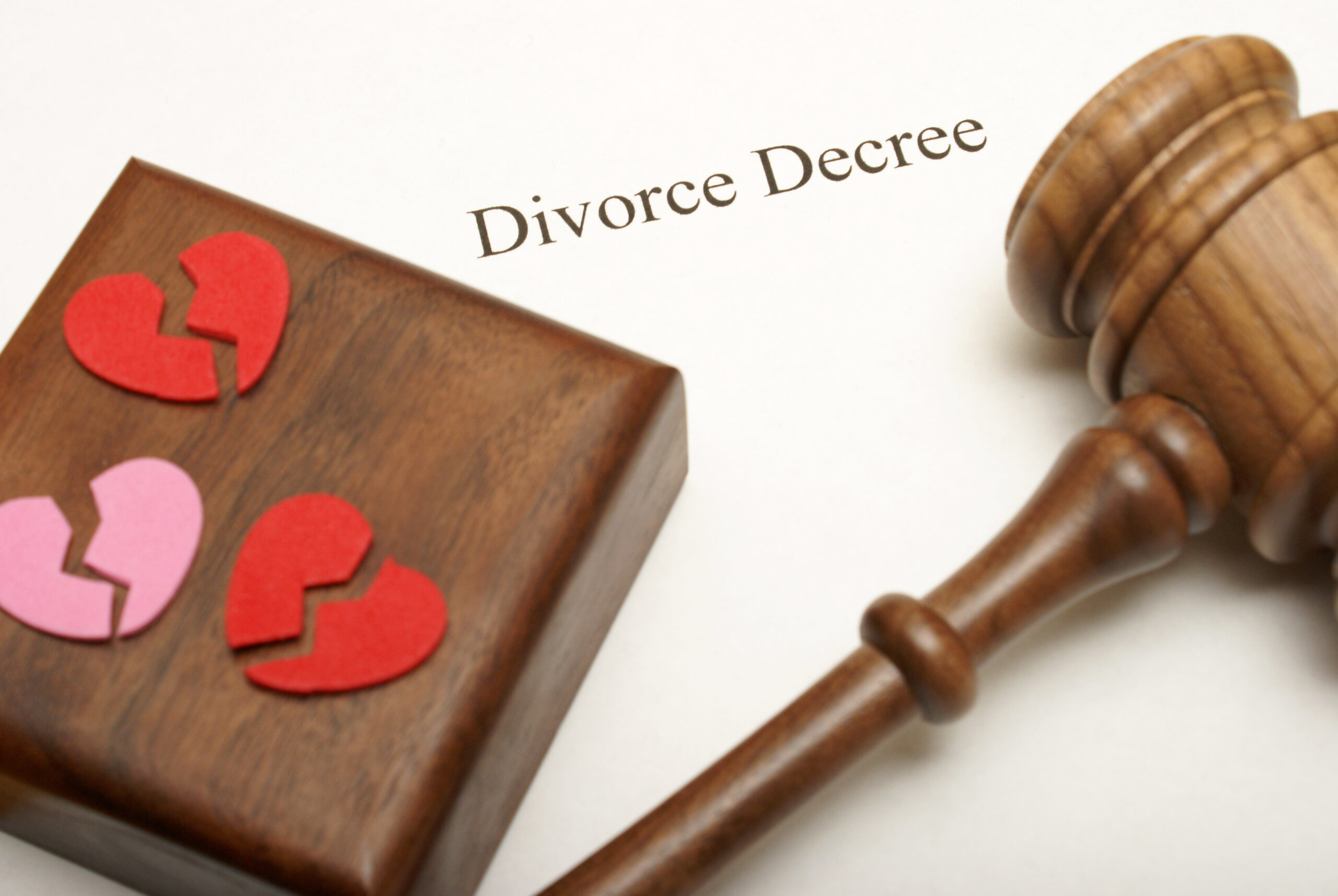 Divorce decree with broken hearts and a gavel