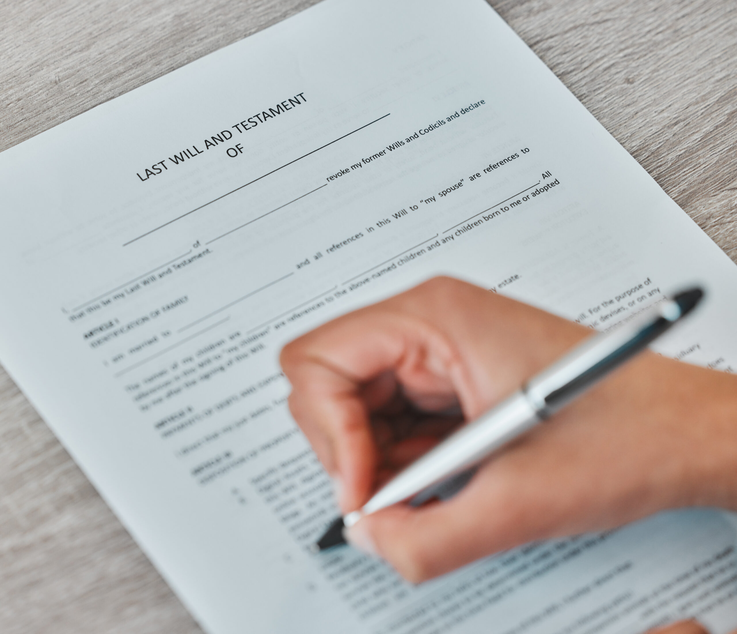 Hands, documents and signature for assets, contract and legal testament or will for agreement. Pers.